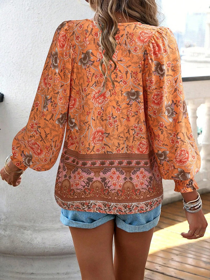 Marije bloemenprint blouse in oranje, achteraanzicht